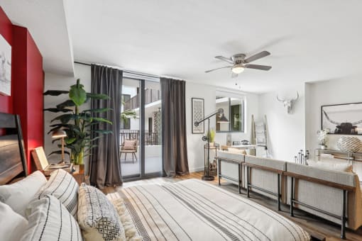 a bedroom with a bed and a ceiling fan