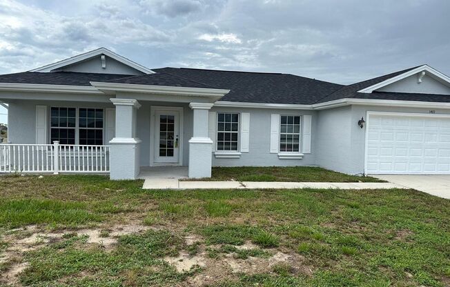 Spacious 3-Bed + Den Home with 2-Car Garage in NE Cape Coral. Special Offer! Qualify for a deposit-free option and save on move-in costs!