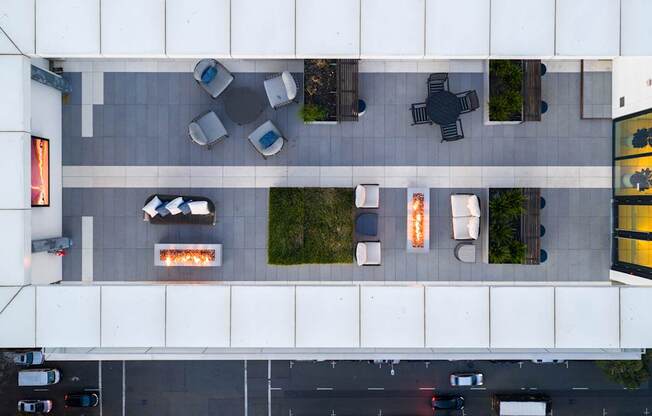 A parking lot with cars and a building with a fireplace.