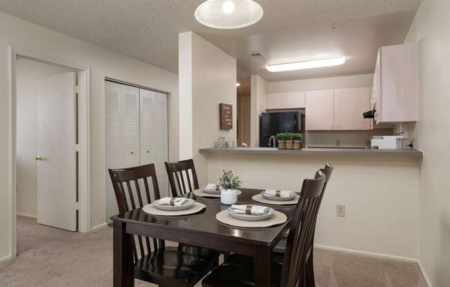 an open kitchen and dining room with a table and chairs