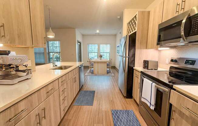 A kitchen with wooden cabinets and a white countertop.