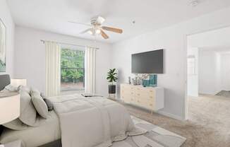 A bedroom with a large bed and a flat screen TV mounted on the wall.