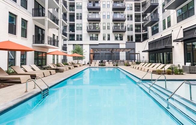 Take a break by the sparkling resort-style pool, complete with lounge seating, shade umbrellas, and space to relax or recharge.