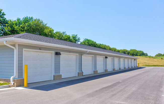 A long row of garage doors are closedat Lofts at Fox Ridge, Raymore, Missouri