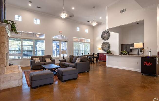 A living room with a fireplace and a large couch.