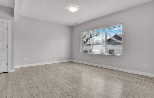 A room with a window and a door.