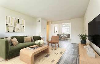 A living room with a green couch and a wooden coffee table.