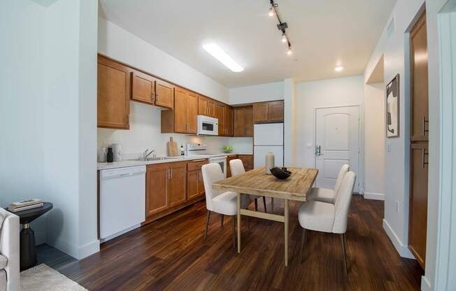 a kitchen and dining area in a 555 waverly unit