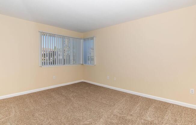 a bedroom with a large window