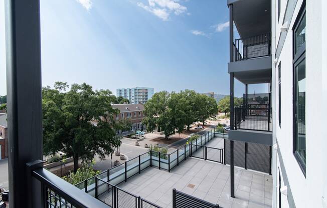 the view from the balcony of an apartment building overlooking the city