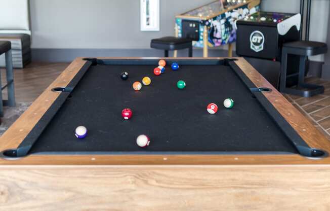 a pool table with a bunch of balls on it