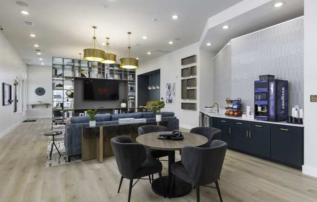 a living room with a table and chairs and a television