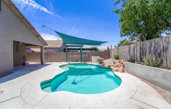 Your Goodyear Retreat Awaits – Updated 4BR Home with Pool & Waterfall