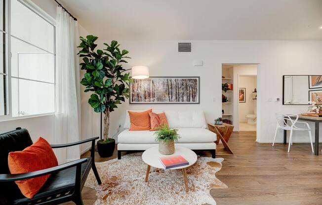 a living room filled with furniture and a fire place