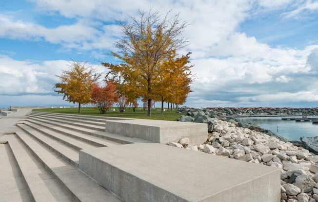 Image of concrete steps, with tree and Lake Michigan in the background