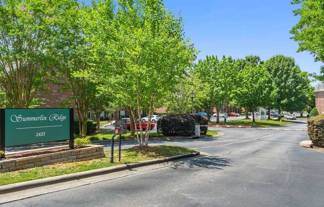 A street view of Summerlin Ridge with a green signboard.