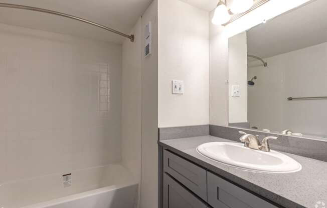 The Beckham Apartments bathroom with sink and shower