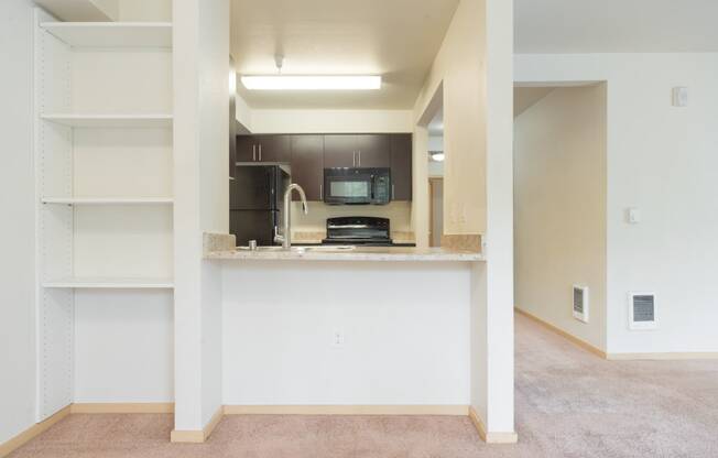 a view of the kitchen from the living room