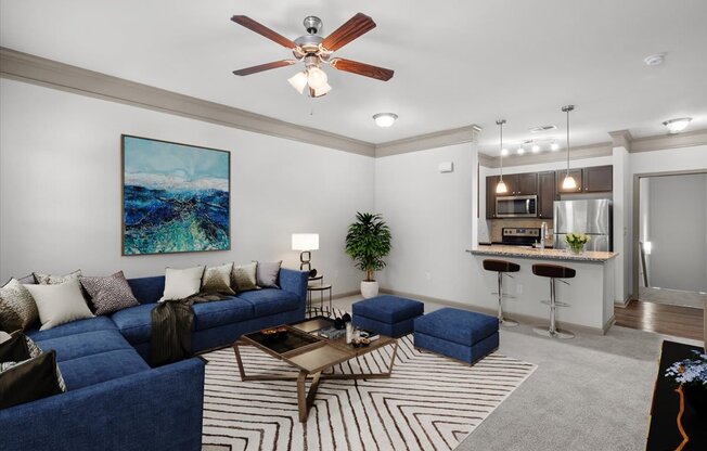 a living room with a blue couch and a coffee table