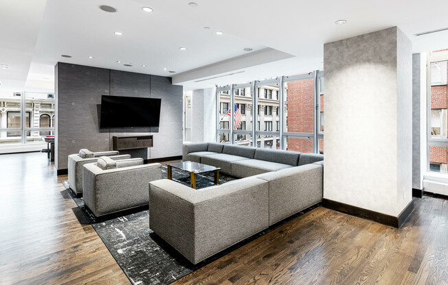 Indoor lounge with media room for two Gold street apartment renters. 