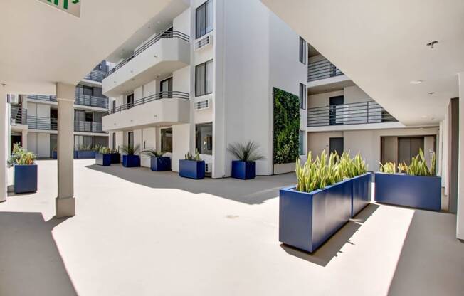 a large white building with a large blue planter in front of it at The Kenmore Los Feliz, Los Angeles, 90027-4063