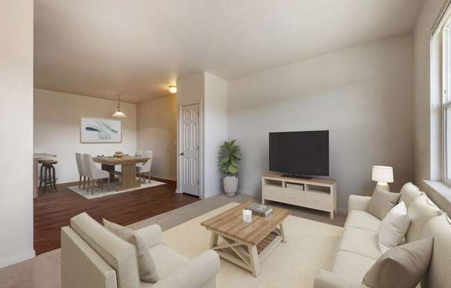 a living room with a couch and a television at Switchback on Platte Apartments, Littleton, Colorado