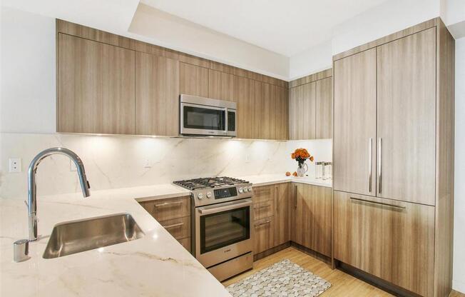 a kitchen with wooden cabinets and a sink