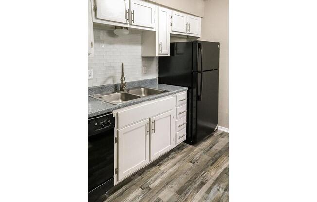 AN ALL-ELECTRIC KITCHEN WITH REFRIGERATOR