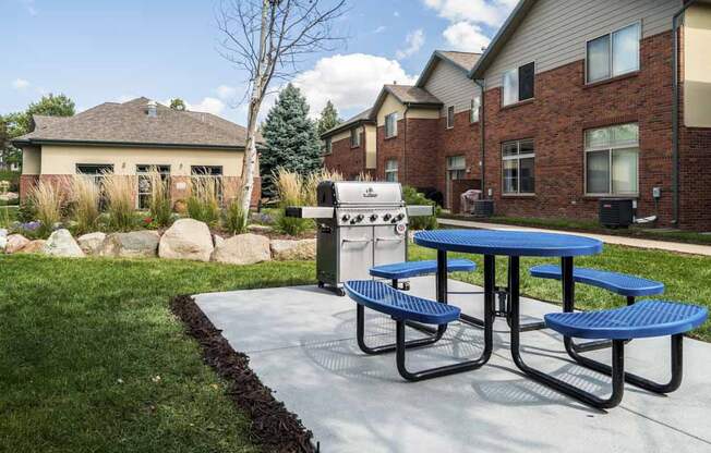 Outdoor grill with picnic table in the courtyard at Southwind Villas in southwest Omaha in La Vista, NE, 68128