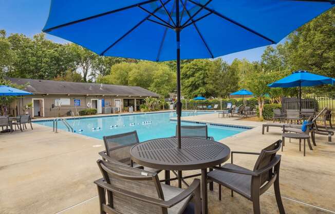 our apartments have a swimming pool and tables with umbrellas