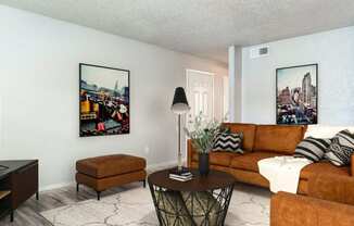 a living room with a couch and a tv  at Shadow Ridge, Arlington, Texas