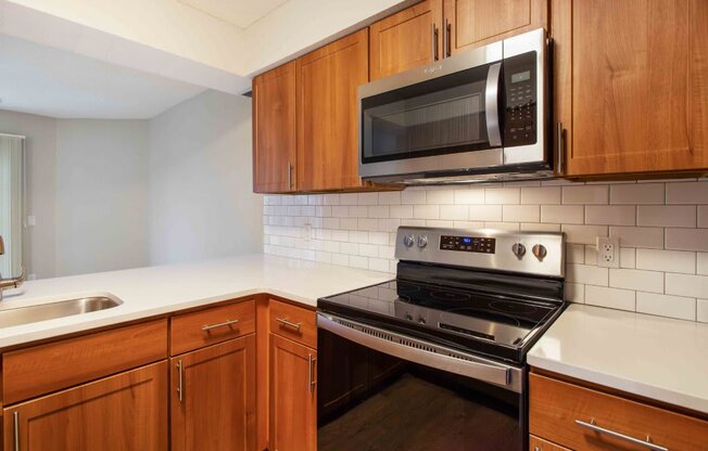 a kitchen with a stove and a microwave