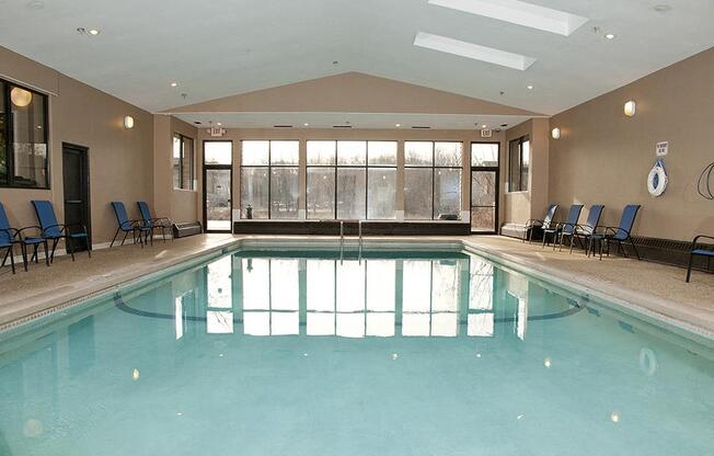 Indoor pool room with large windows