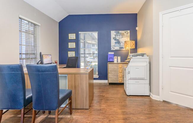 a kitchen with a blue chair