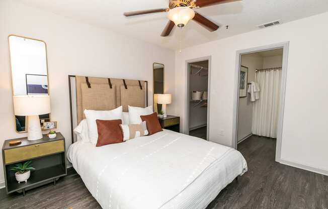 a bedroom with a large bed and a ceiling fan at Briarcliff Apartments, Atlanta