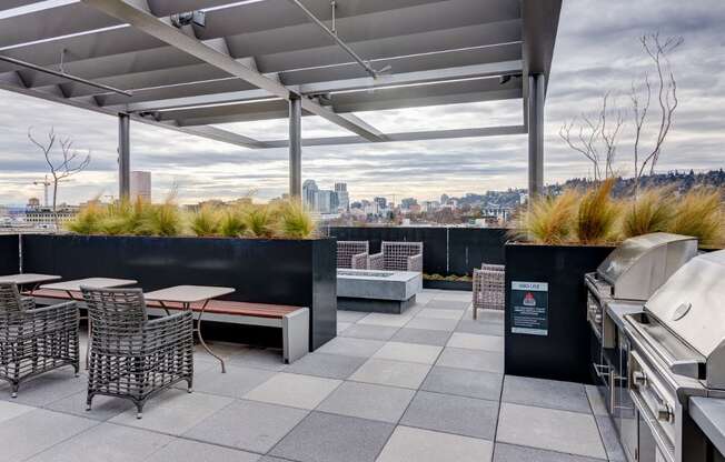 Apartments in Portland - Muse Apartments Rooftop Lounge With Stainless Steel Grills, Outdoor Seating, Firepit and Gorgeous, Expansive Views