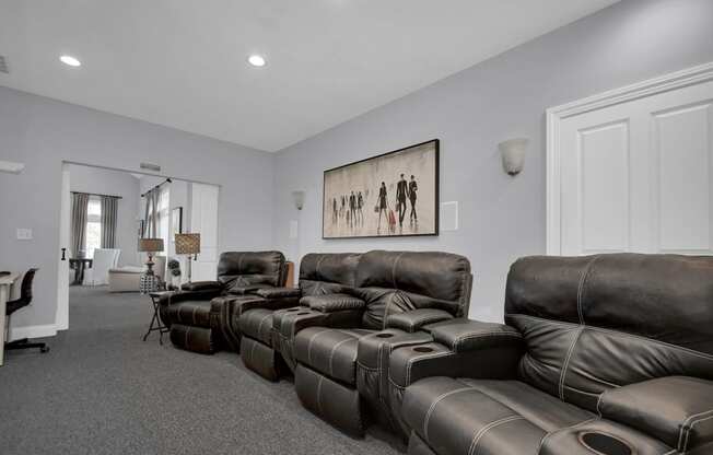 a living room with couches and chairs