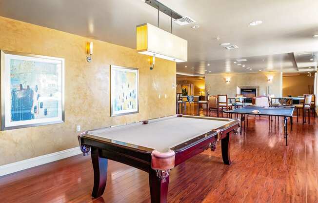 a game room with a pool table and ping pong