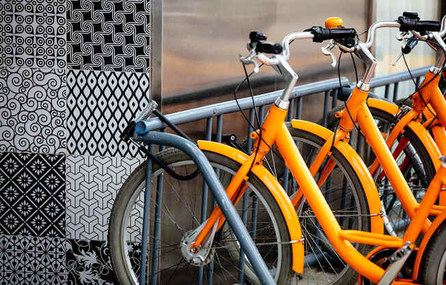 a row of bikes parked next to a window at The Paxton, Brooklyn
