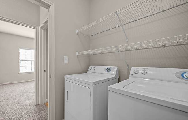 A laundry room with a washer and dryer.