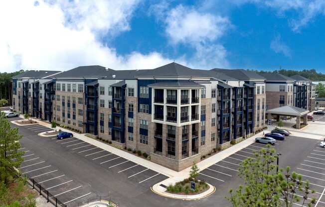 an aerial view of an apartment building in a parking lot at Preston Ridge, Cary, 27513