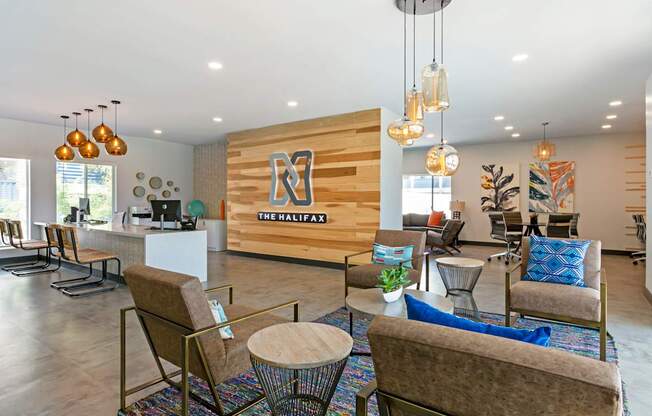 A modern waiting room with a wooden wall and comfortable seating.