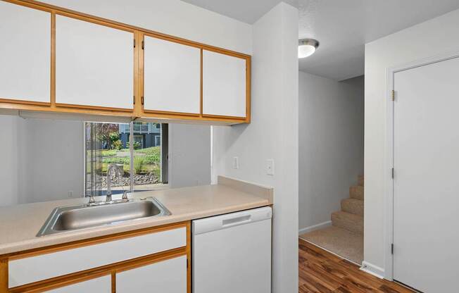 a kitchen with a sink and a window