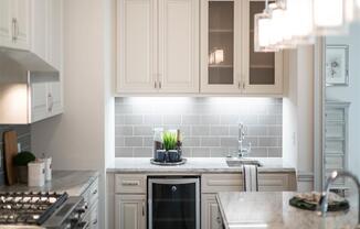 A kitchen with a stove, oven, and cabinets.