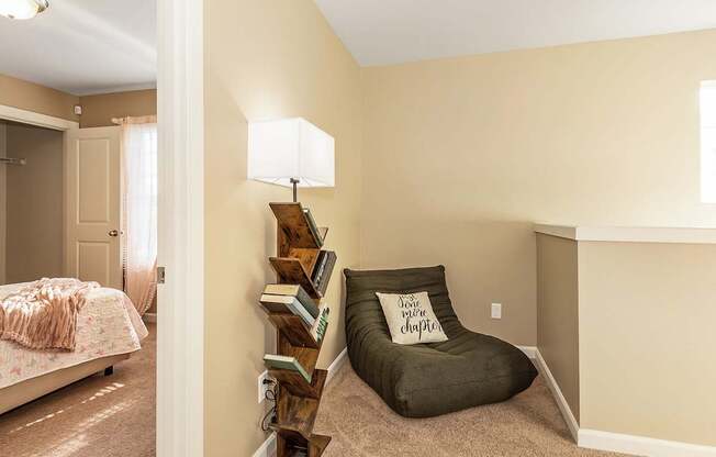 A nook with a chair and a lamp at The Landing Apartments and Townhomes, Oregon, 97045