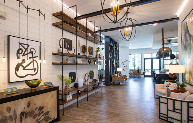 a living room with a white brick wall and a lobby with furniture