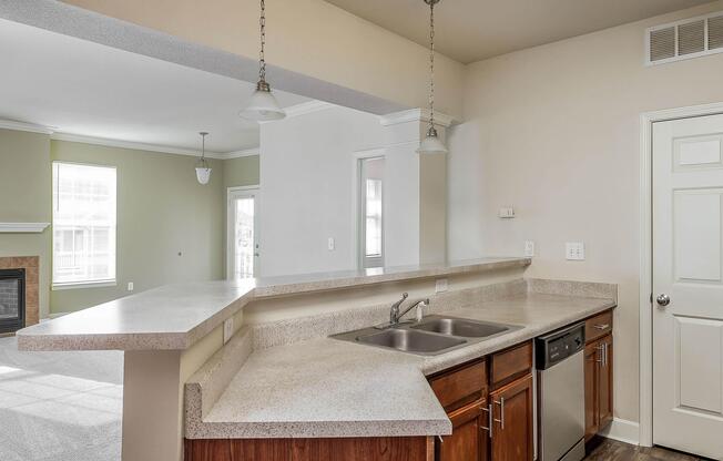 a kitchen with a sink and a mirror