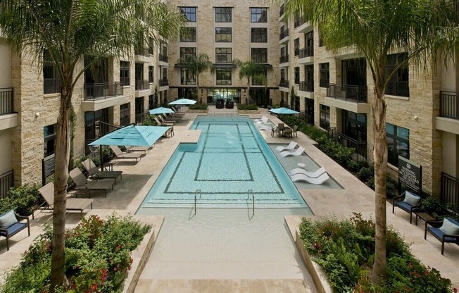 a large swimming pool in the middle of an apartment building