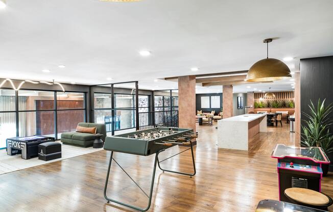 A dynamic resident retreat at Modera Higley Commons, featuring open gathering areas, curated games, and flexible spaces designed for connection.
