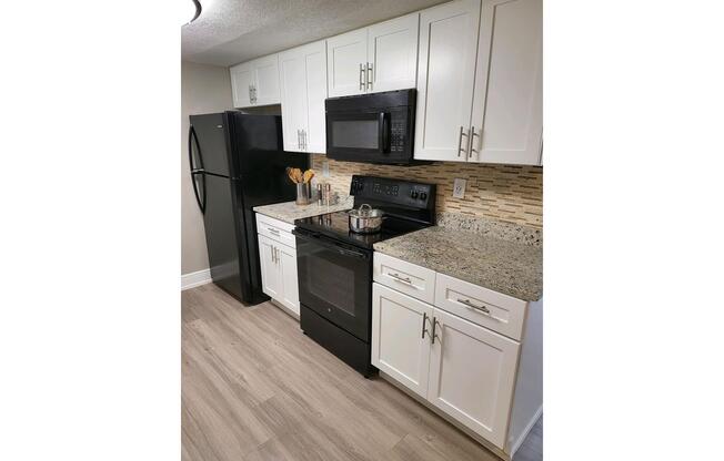 a kitchen with a stove and a sink